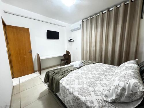Postel nebo postele na pokoji v ubytování Apto próximo ao centro 01 quarto