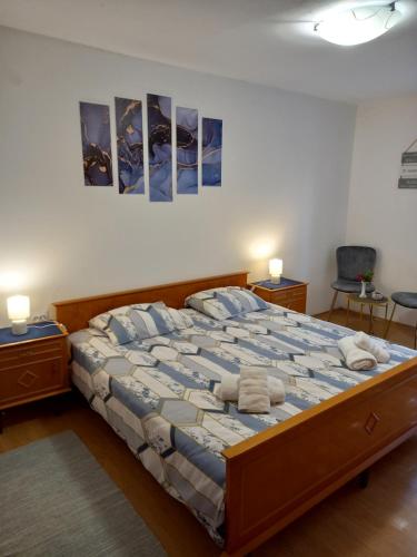a bedroom with a large bed with two night stands at Summer Dream in Rovinj