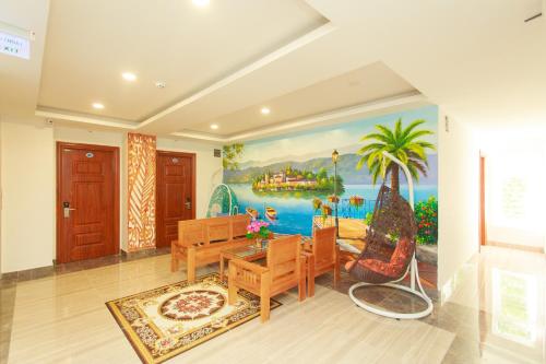 a dining room with a painting on the wall at Hopapa Hotel & Spa Phu Quoc in Phu Quoc