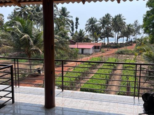 a view from the balcony of a resort at The Brine Breeze Gokarna in Gokarn