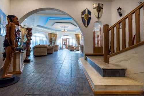 a hallway with an archway in a living room at Gaia Garden in Kos Town