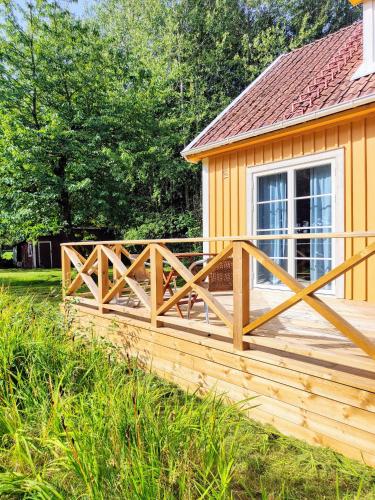 a wooden deck in front of a house at Haus Ole 