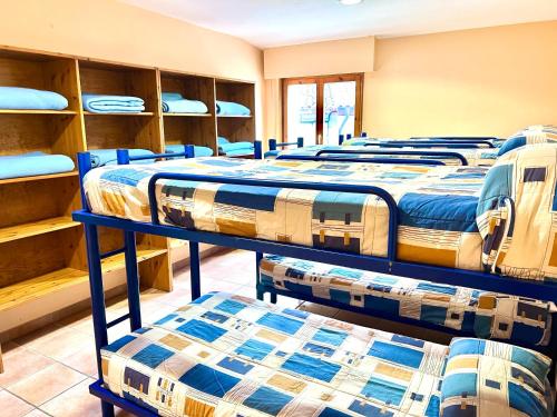a row of beds in a room at Albergue Urbasa in Eulate