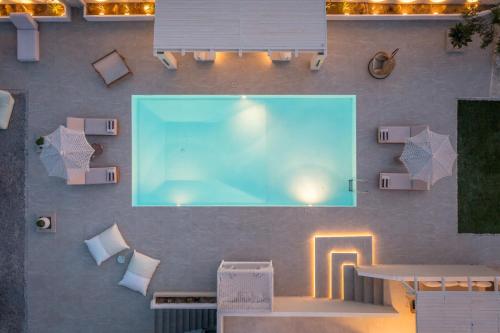 an overhead view of a swimming pool on a wall at Villa Eva By Milos Concierge in Adamas