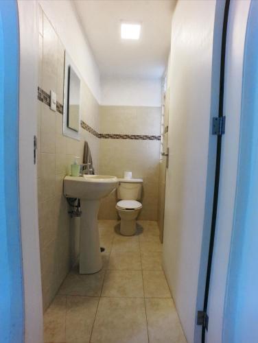 a bathroom with a toilet and a sink at Mexicaníssima 4BR, 4 to 11 guests in Coyoacán in Mexico City