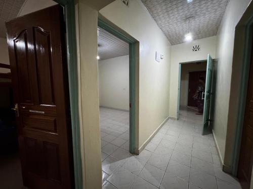 a hallway of a house with a door and a room at Tekas Housing - Ngong Hills in Kiserian