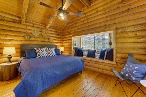 a bedroom with a bed in a log cabin at Covered Deck, Private Acreage: Log Cabin in Pine in Pine
