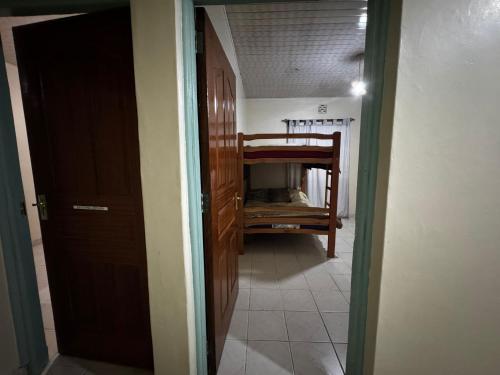 a hallway with a room with a bed in it at Tekas Housing - Ngong Hills in Kiserian
