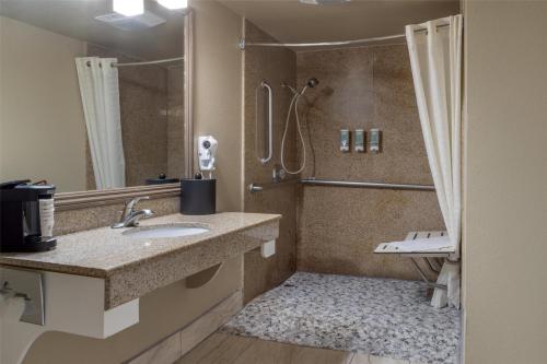 a bathroom with a sink and a shower at Best Western Heritage Inn in Concord