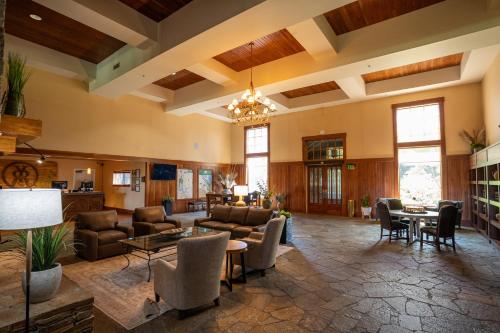 a large living room with couches and a table at Running Y Ranch Golf & Spa Resort in Klamath Falls