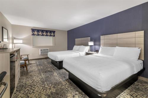 Ένα ή περισσότερα κρεβάτια σε δωμάτιο στο Best Western Caribou Inn