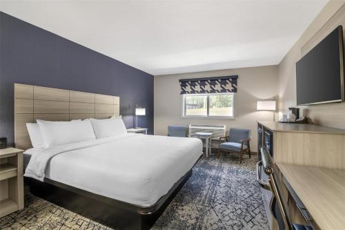 Ένα ή περισσότερα κρεβάτια σε δωμάτιο στο Best Western Caribou Inn