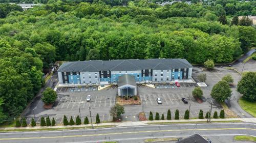 an aerial view of a building with a parking lot at Best Western Manchester in Manchester
