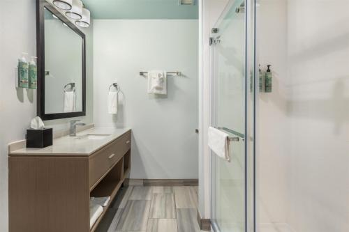 a bathroom with a glass shower and a sink at Best Western Manchester in Manchester