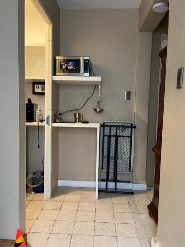 a kitchen with a counter with a microwave on it at Pequeña París Coyoacán, Habitación Privada WiFi in Mexico City