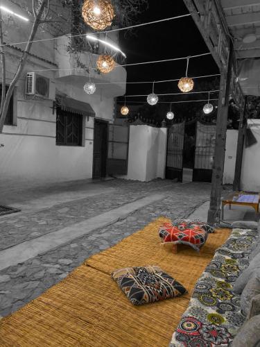 two umbrellas sitting on a floor in a room at Fnex Motel in Dahab