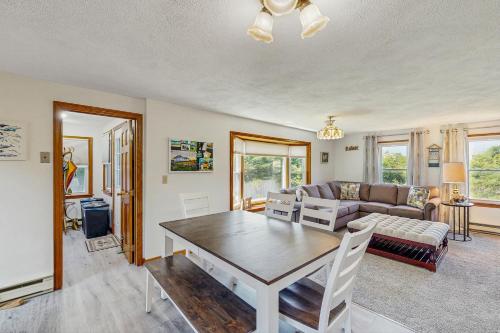 a living room with a table and a couch at Ireland Time in Nantucket