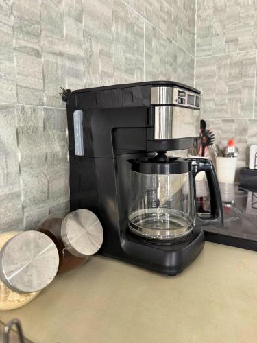 a coffee maker sitting on top of a counter at Your Cozy Corner in Oaxaca with AC in Oaxaca City