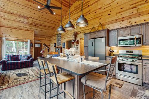 a kitchen with a table and chairs in a room at Beacon Point in Presque Isle