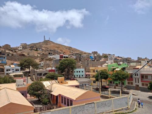 a view of a city with a hill in the background at Casa da Sara Guest House in Mindelo