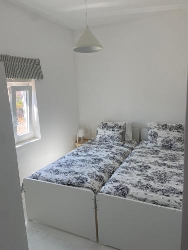 Postel nebo postele na pokoji v ubytování Casinha da praia