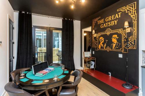 a room with a table with a laptop on it at Rooftop Deck Hot Tub Fire pit Sleeps 10 in Nashville