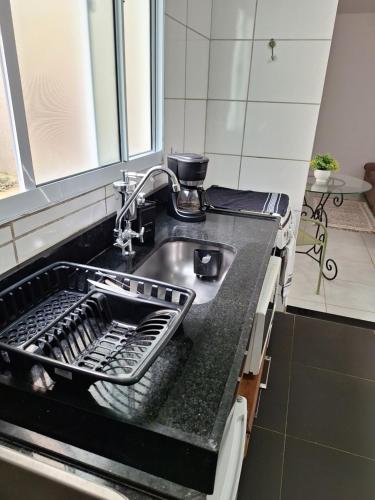Dapur atau dapur kecil di Apartamento Acolhedor