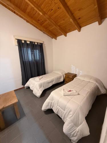 Ένα ή περισσότερα κρεβάτια σε δωμάτιο στο Complejo de la Villa - Apart Hotel