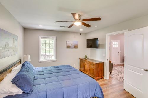 a bedroom with a blue bed and a ceiling fan at half Mi to Kentucky Downs Franklin Home with Patio! in Franklin