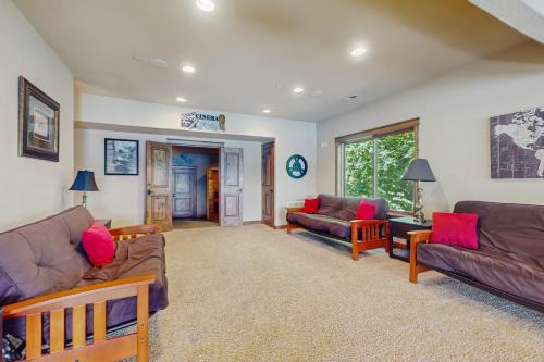 a living room with two couches and a table at DeJa View in Hayden