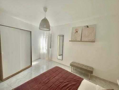 a bedroom with a bed and a bench in it at Casa do Areal in Laxe