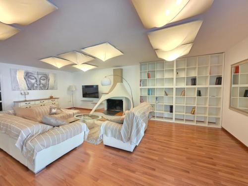 a living room with a couch and a fireplace at Donna Rosa in Pagani