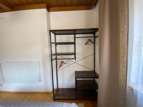 a room with a staircase with shoes on the wall at Landhaus Marmorata FeWo in Sattendorf