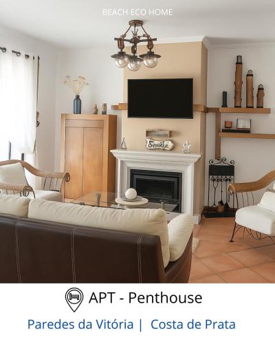 a living room with a couch and a fireplace at BEACH ECO HOME Penthouse in Senhora da Vitória
