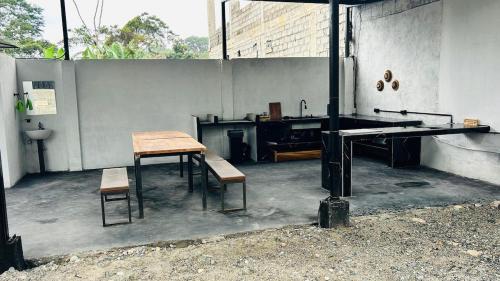 a room with a table and chairs and a desk at Tena Tower House TTH in Tena