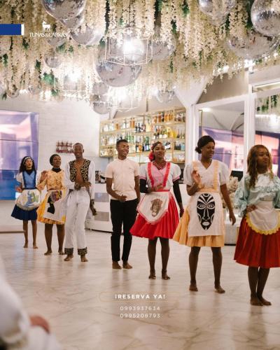 a group of people standing in a store at Tunas & Cabras Hotel in Ibarra