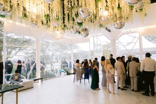a group of people standing in a white tent at Tunas & Cabras Hotel in Ibarra