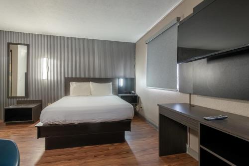 a hotel room with a bed and a desk at Studio 6 Limon, CO I 70 in Limon