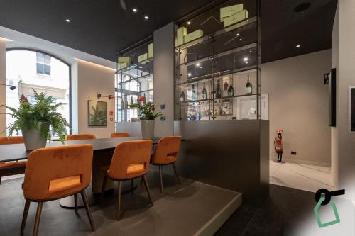 a dining room with a table and chairs at HOTIDAY Room Collection - Milano Cinque Giornate in Milan