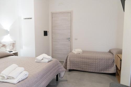Postel nebo postele na pokoji v ubytování Agriturismo L'Oasi