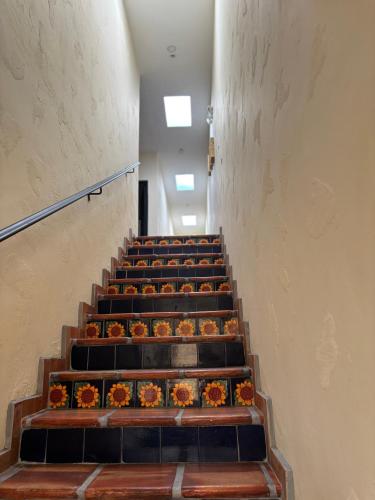 a staircase with a bunch of pumpkins on it at Estancia Colobri in Guadalajara