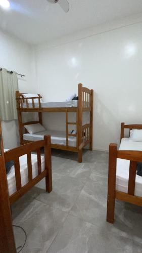 a room with two bunk beds in it at renascer in Mauá