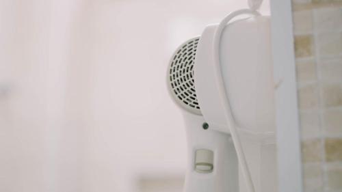 a shower mixer in a bathroom with a shower curtain at renascer in Mauá