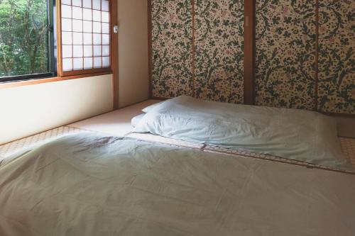 Postel nebo postele na pokoji v ubytování NASU terrace LEI プライベートバレルサウナとハーブ香るガーデンBBQ