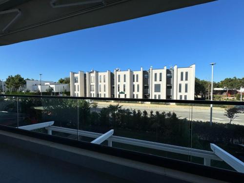 a view from a window of a building with a parking lot at Blin B&B in Draçi