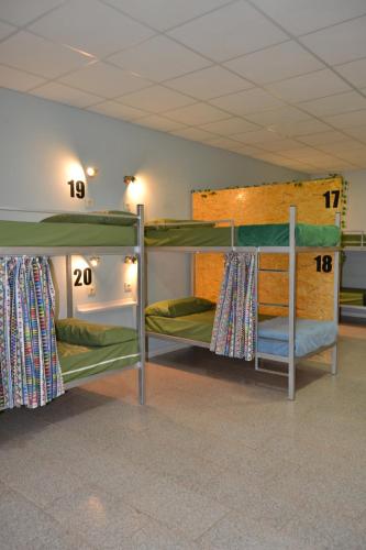 a group of bunk beds in a room at Albergue Valle del Nonaya in Salas