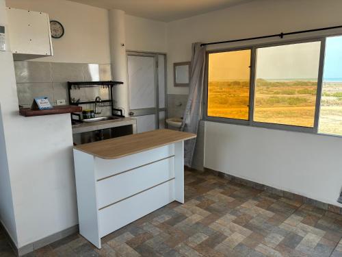 a kitchen with a counter top and a window at Casa Bita Morales CASA 201 in Cartagena de Indias