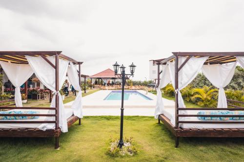 a wedding venue with two beds and a pool at Casa Bita Morales CASA 201 in Cartagena de Indias