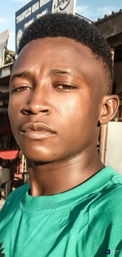 a mannequin of a boy wearing a green shirt at Dr Robert in Kibaha