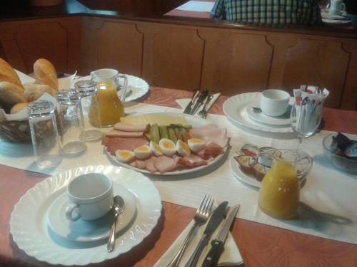 a table with plates of food on top at Gasthaus Rössle in Rottweil